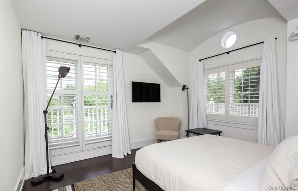 a bedroom with a bed and a view living room