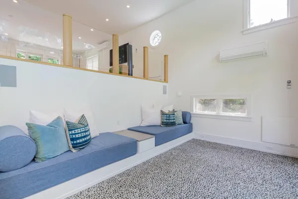 a building outdoor space with patio furniture and potted plants