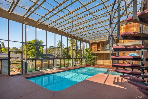 a view of swimming pool with outdoor seating