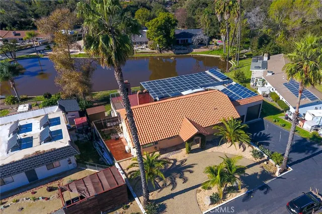 a view of a lake with a house in the background