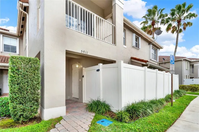 a view of a street with a house