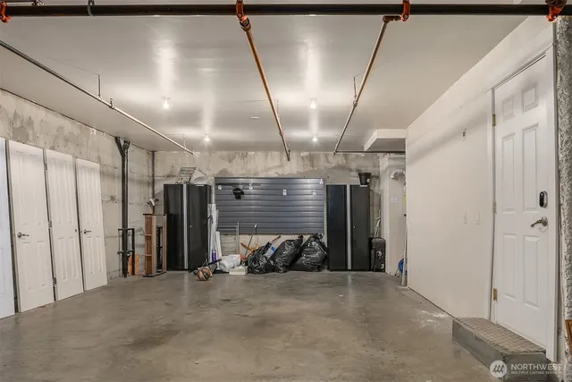 a view of empty room with wooden walls