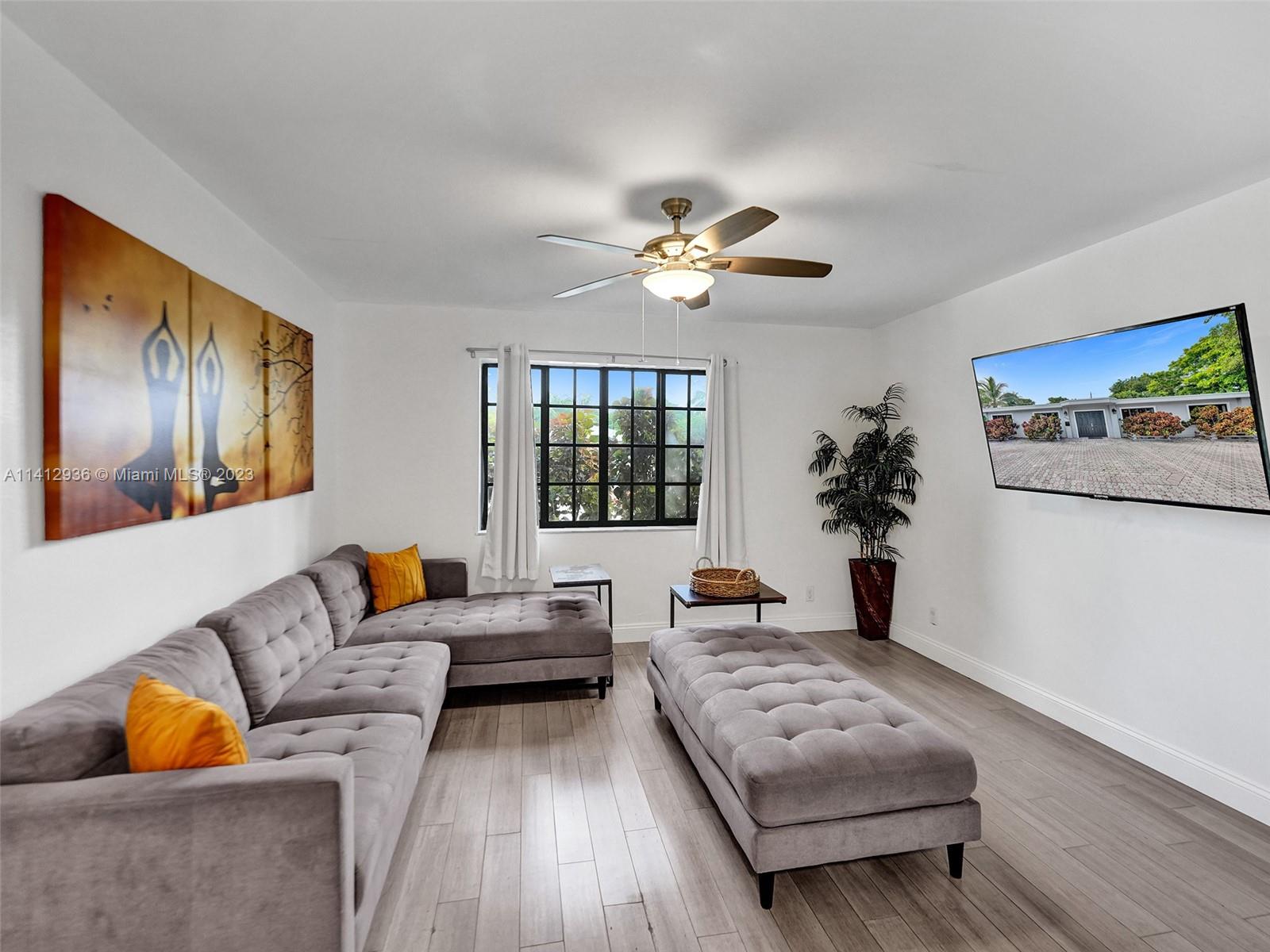 2500 Northeast 19th Street Pompano Beach, FL 33062 - Photo 14 of 51 a living room with furniture rug and window