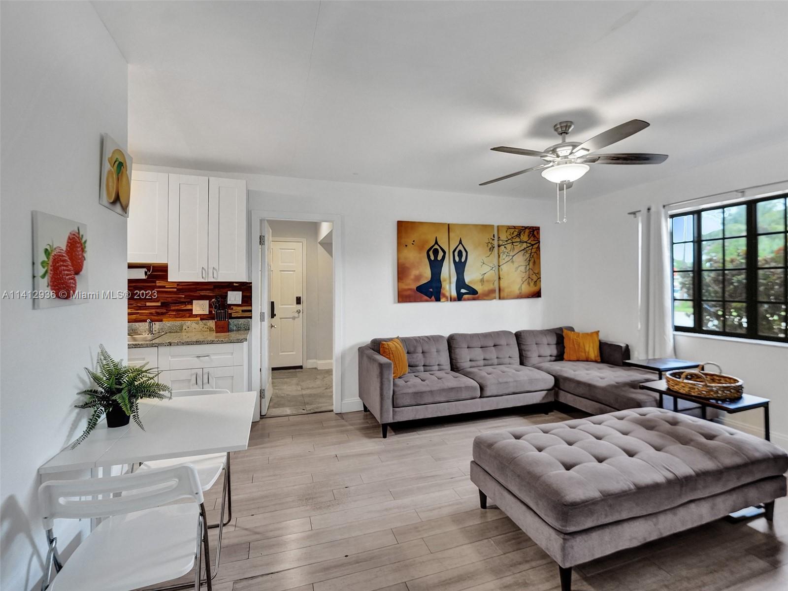 2500 Northeast 19th Street Pompano Beach, FL 33062 - Photo 17 of 51 a living room with furniture flat screen tv and potted plant