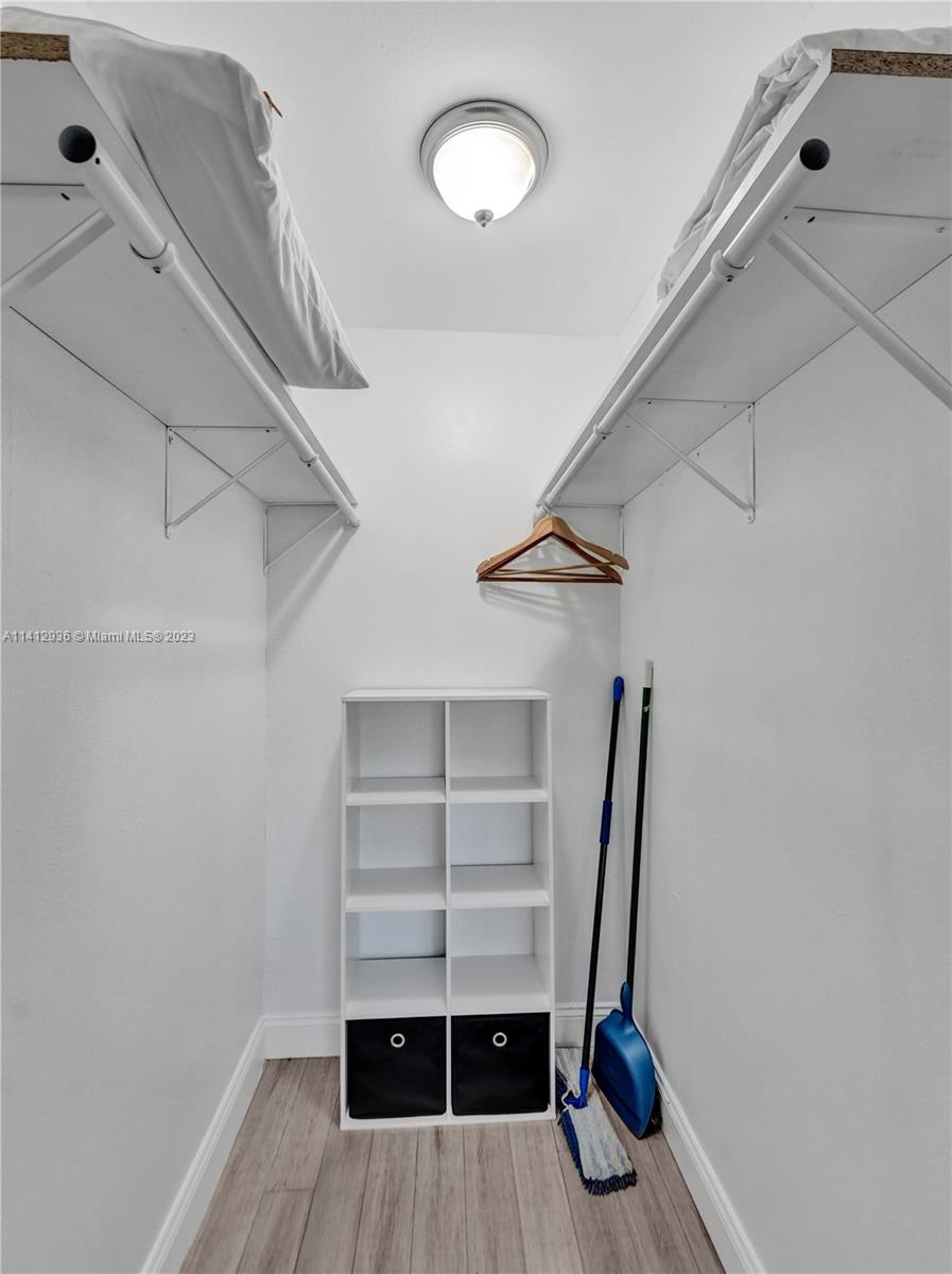 2500 Northeast 19th Street Pompano Beach, FL 33062 - Photo 24 of 51 a view of walk in closet with empty racks