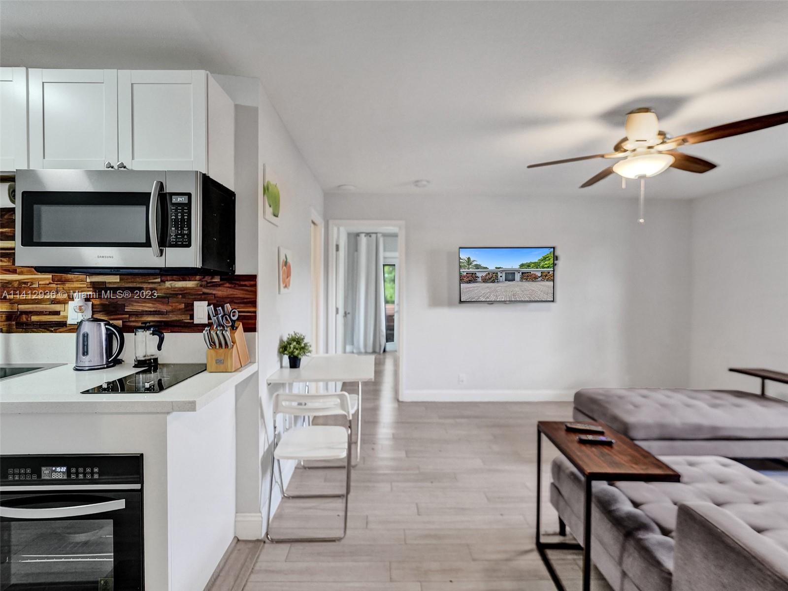 2500 Northeast 19th Street Pompano Beach, FL 33062 - Photo 27 of 51 a view of kitchen with cabinets stainless steel appliances and a window