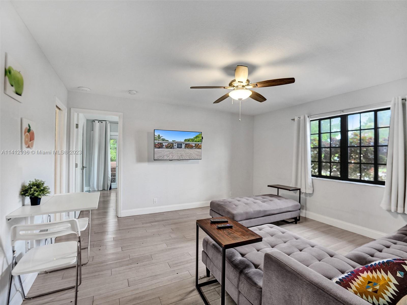 2500 Northeast 19th Street Pompano Beach, FL 33062 - Photo 28 of 51 a living room with furniture and window