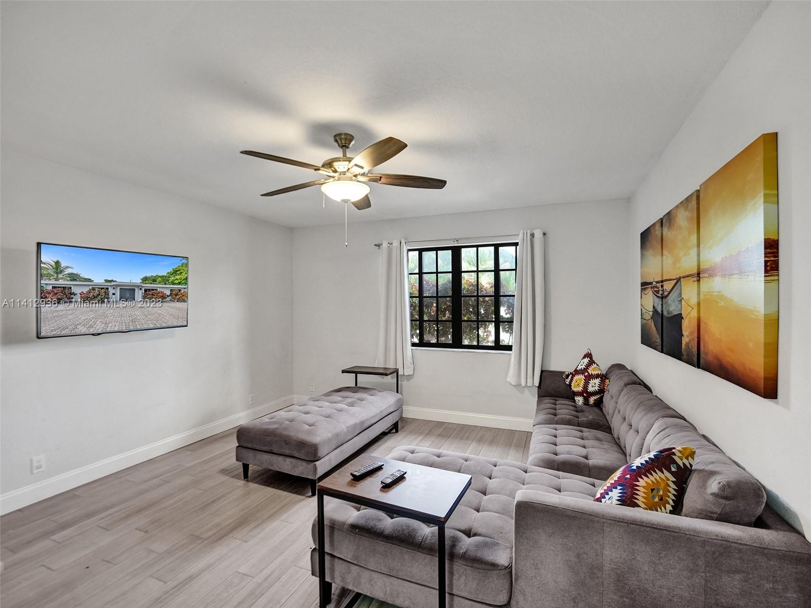 2500 Northeast 19th Street Pompano Beach, FL 33062 - Photo 29 of 51 a living room with furniture and wooden floor