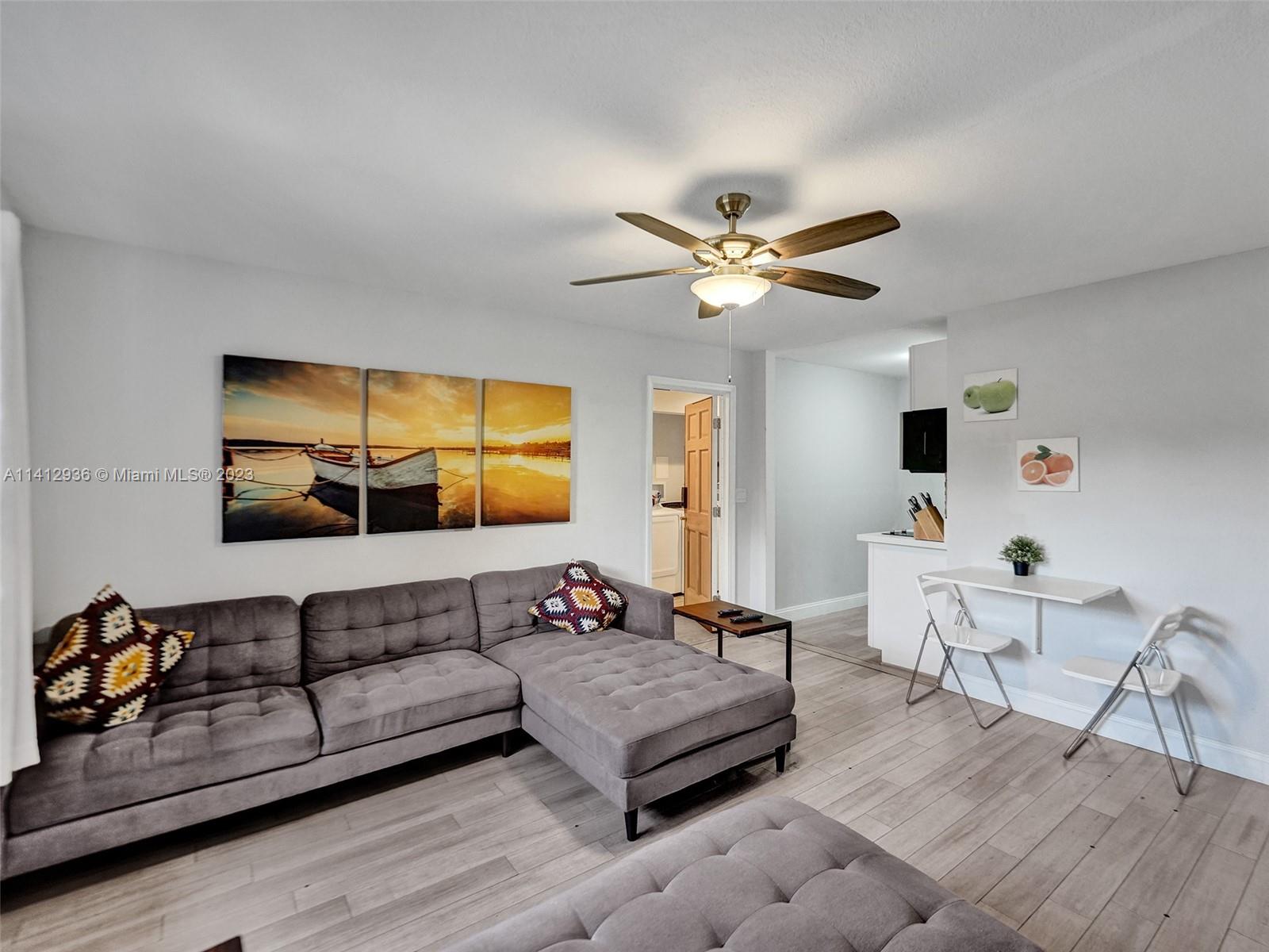 2500 Northeast 19th Street Pompano Beach, FL 33062 - Photo 30 of 51 a living room with furniture and a large window