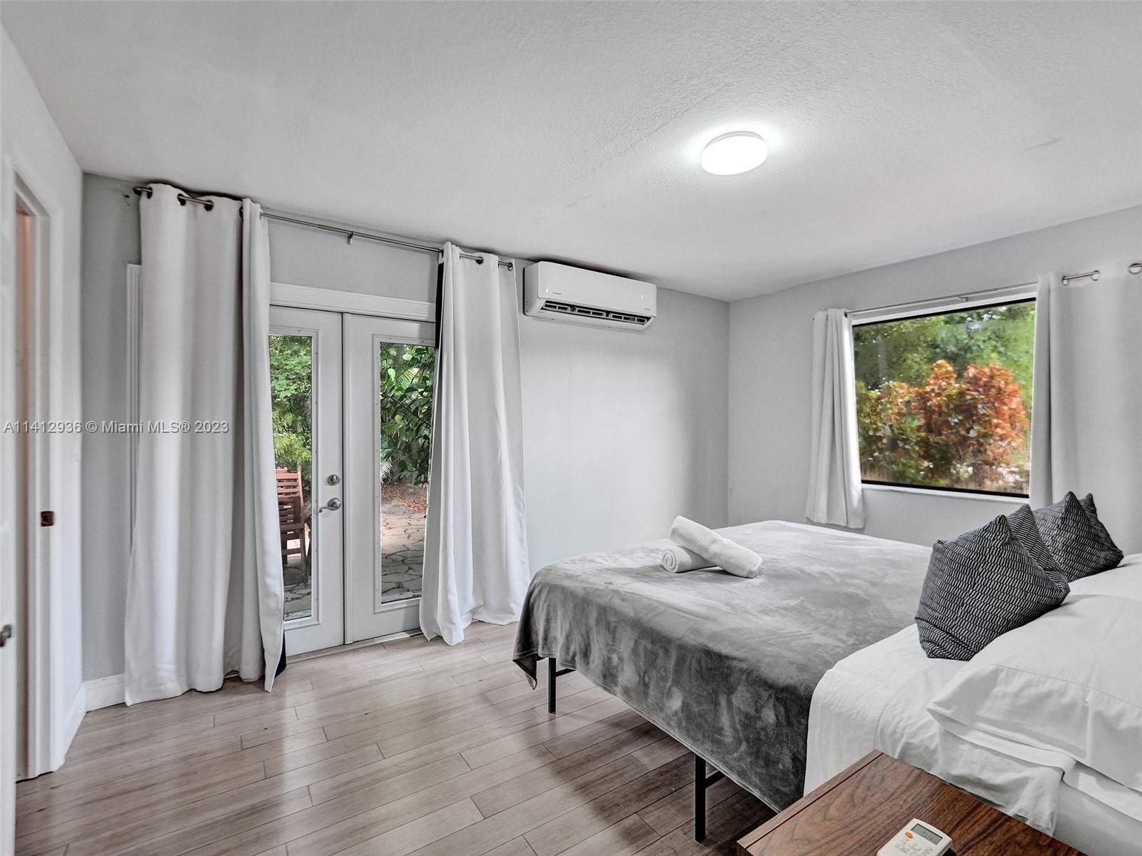 2500 Northeast 19th Street Pompano Beach, FL 33062 - Photo 38 of 51 a bedroom with a bed and a window