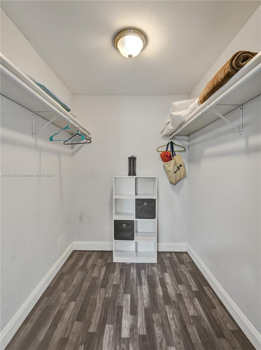 2500 Northeast 19th Street Pompano Beach, FL 33062 - Photo 40 of 51 a view of a room with wooden floor and white walls