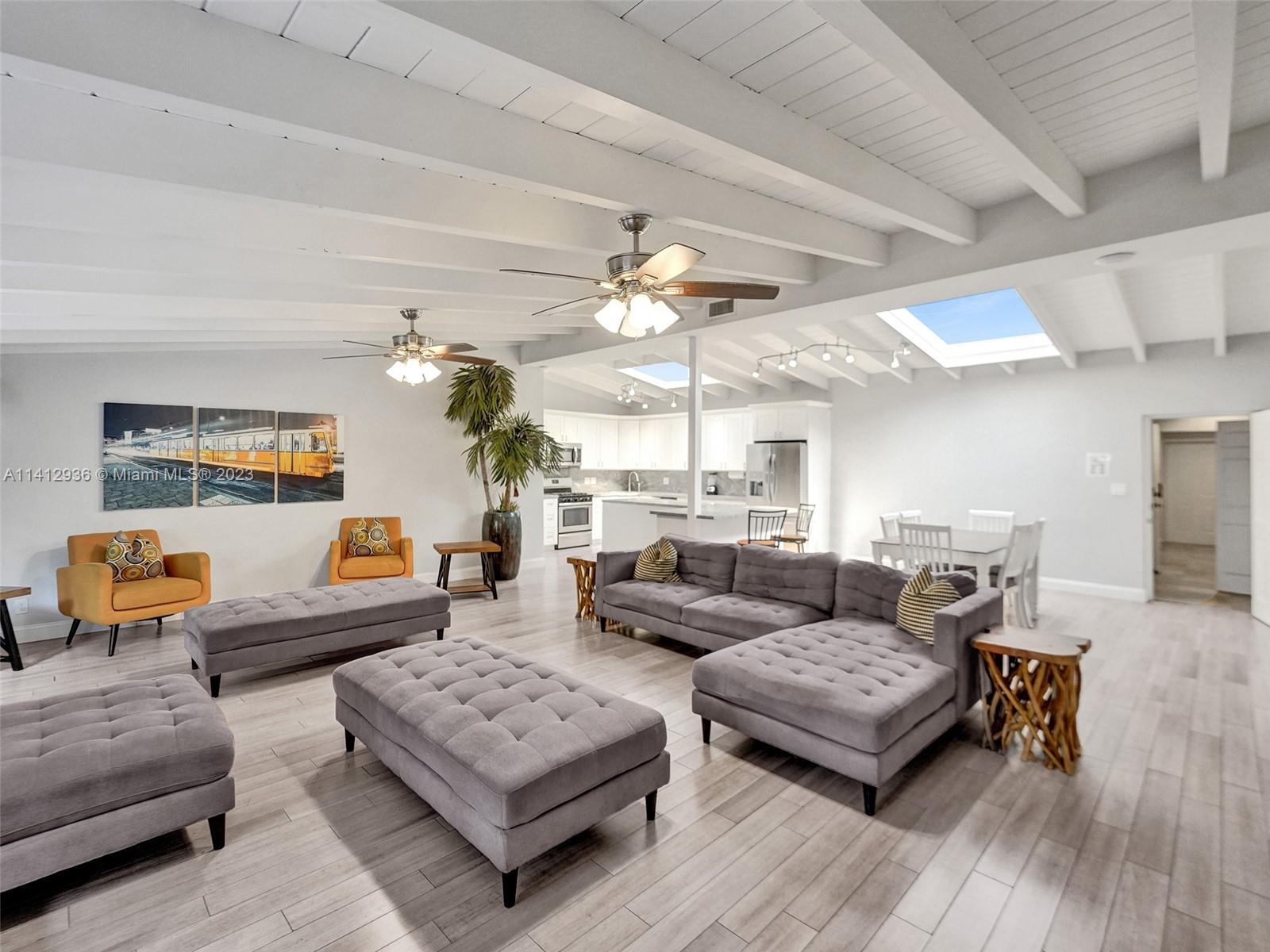 2500 Northeast 19th Street Pompano Beach, FL 33062 - Photo 4 of 51 a living room with furniture and wooden floor