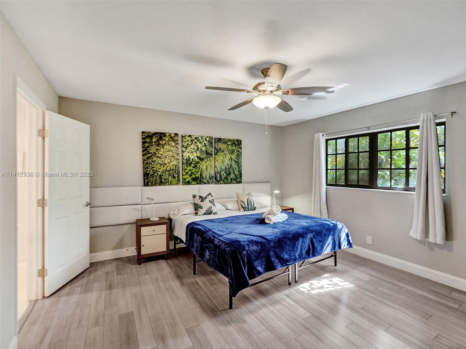 2500 Northeast 19th Street Pompano Beach, FL 33062 - Photo 44 of 51 a living room with a bed furniture and a window
