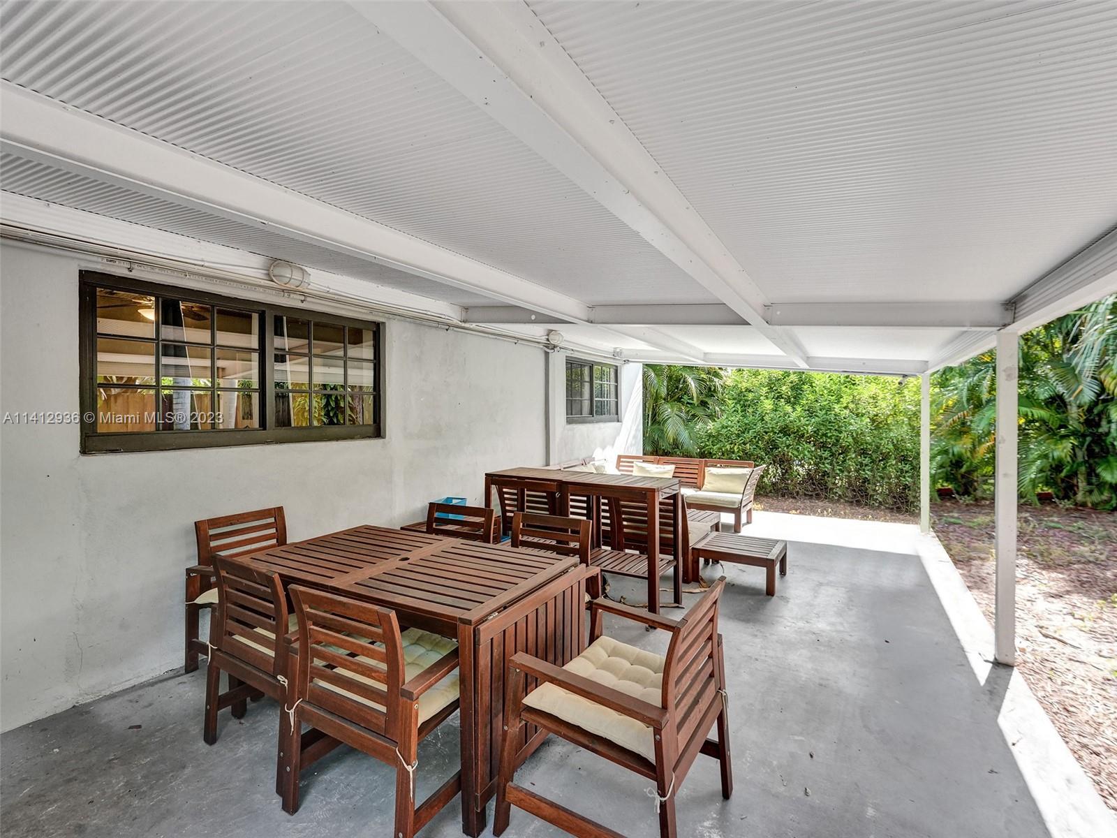 2500 Northeast 19th Street Pompano Beach, FL 33062 - Photo 50 of 51 a backyard of a house with yard fire pit table and chairs