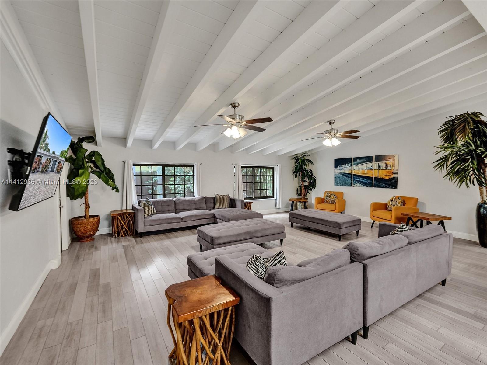 2500 Northeast 19th Street Pompano Beach, FL 33062 - Photo 7 of 51 a living room with furniture and a wooden floor
