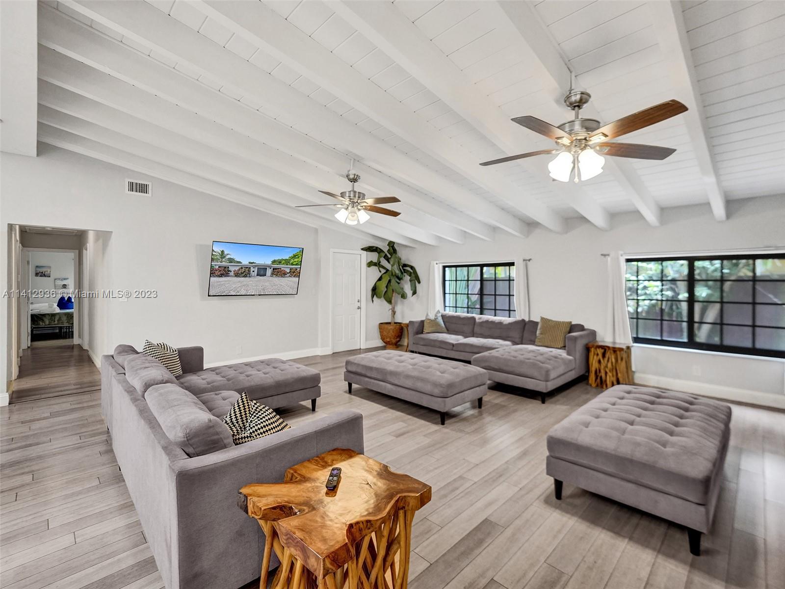 2500 Northeast 19th Street Pompano Beach, FL 33062 - Photo 8 of 51 a living room with furniture and a large window