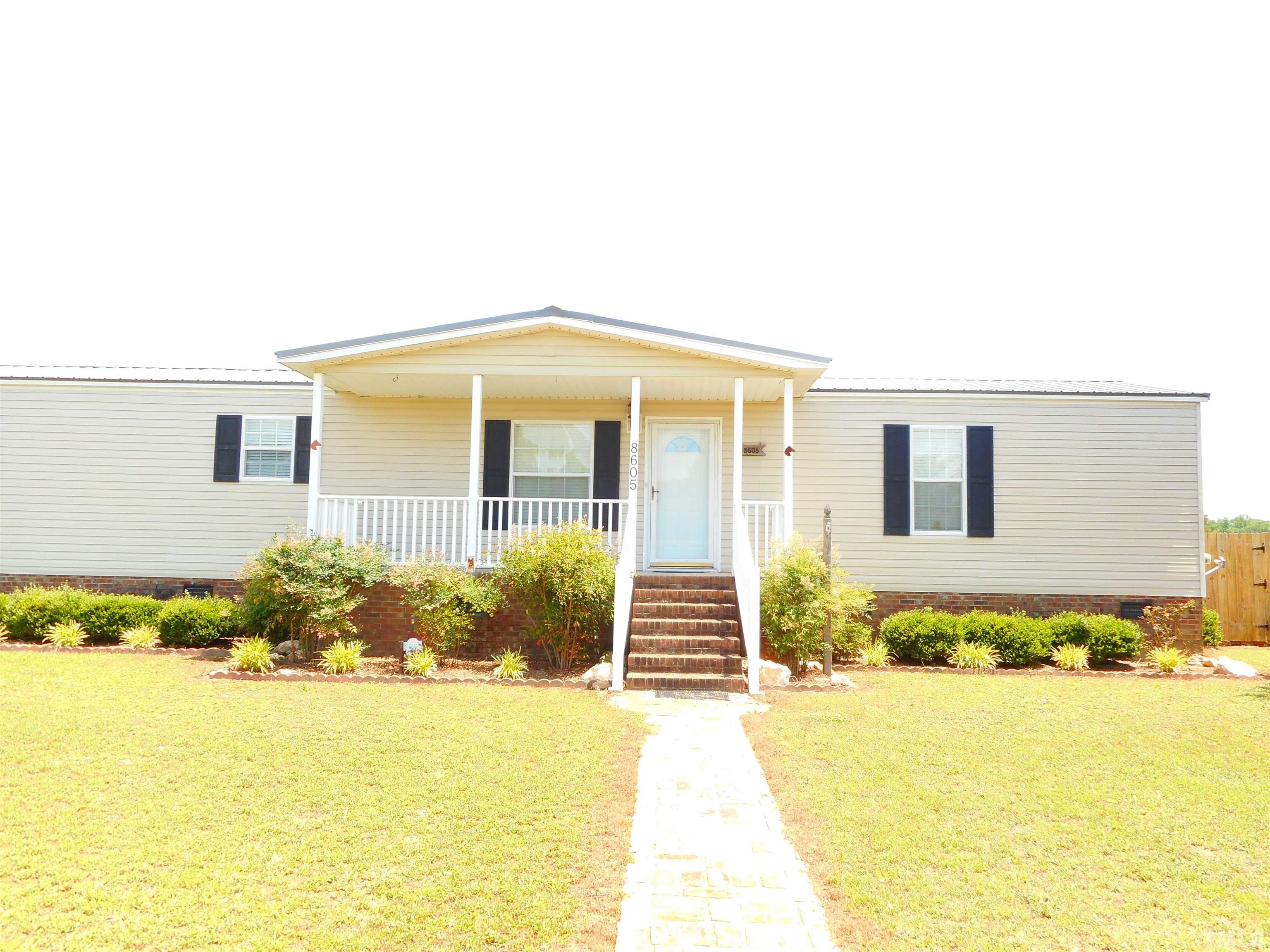 8605 Ransom Lane Kenly, NC 27542 - Photo 2 of 38 a front view of house with outdoor space