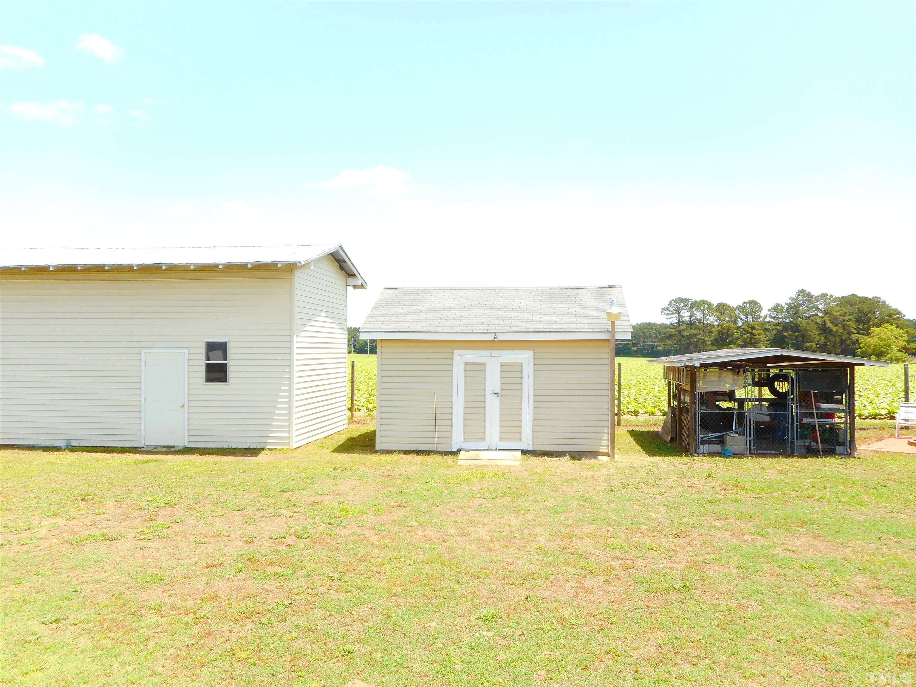 8605 Ransom Lane Kenly, NC 27542 - Photo 3 of 38 a view of a swimming pool with an outdoor seating