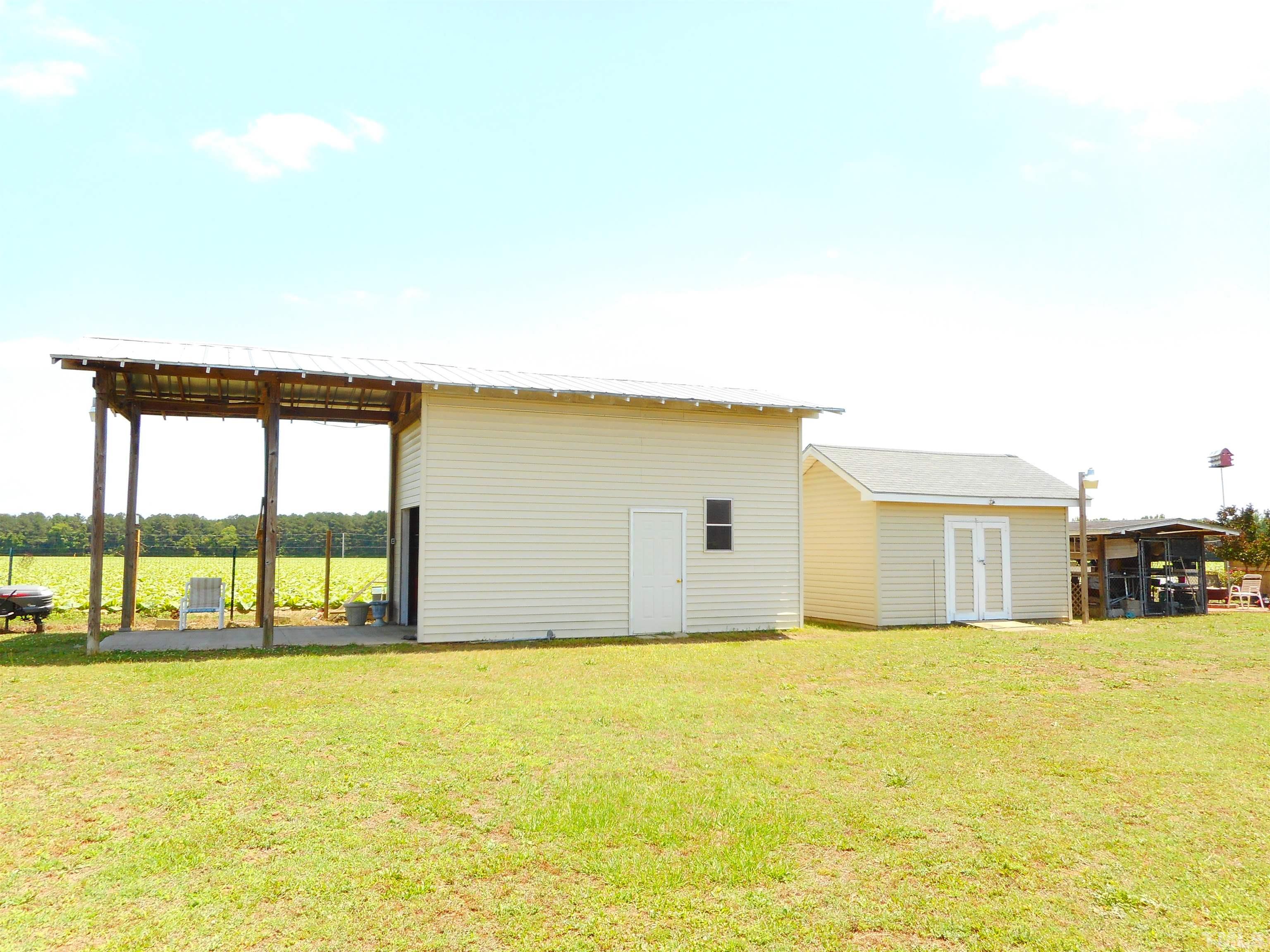 8605 Ransom Lane Kenly, NC 27542 - Photo 5 of 38 a view of a swimming pool with an outdoor seating