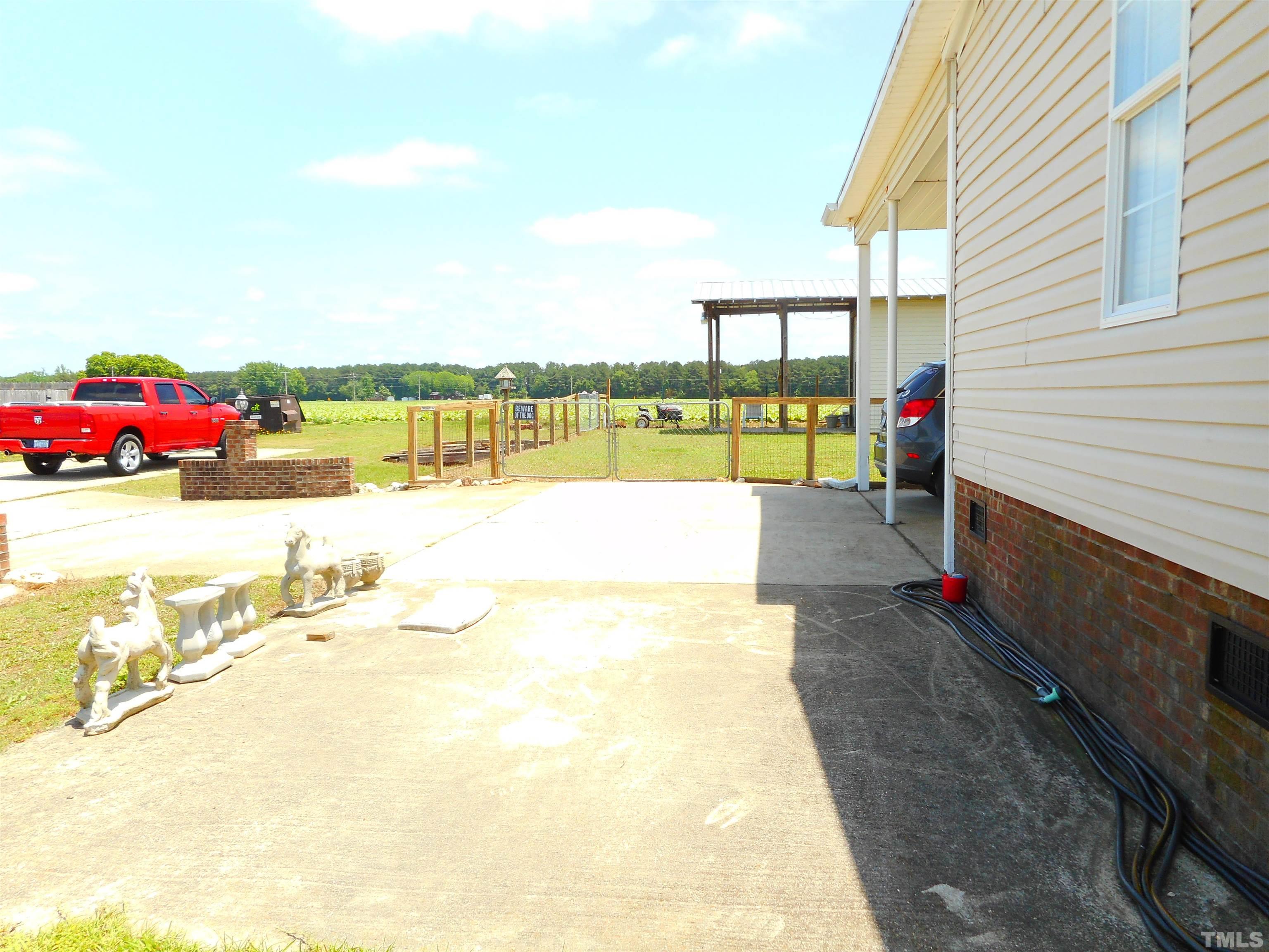 8605 Ransom Lane Kenly, NC 27542 - Photo 7 of 38 a view of a swimming pool with a terrace
