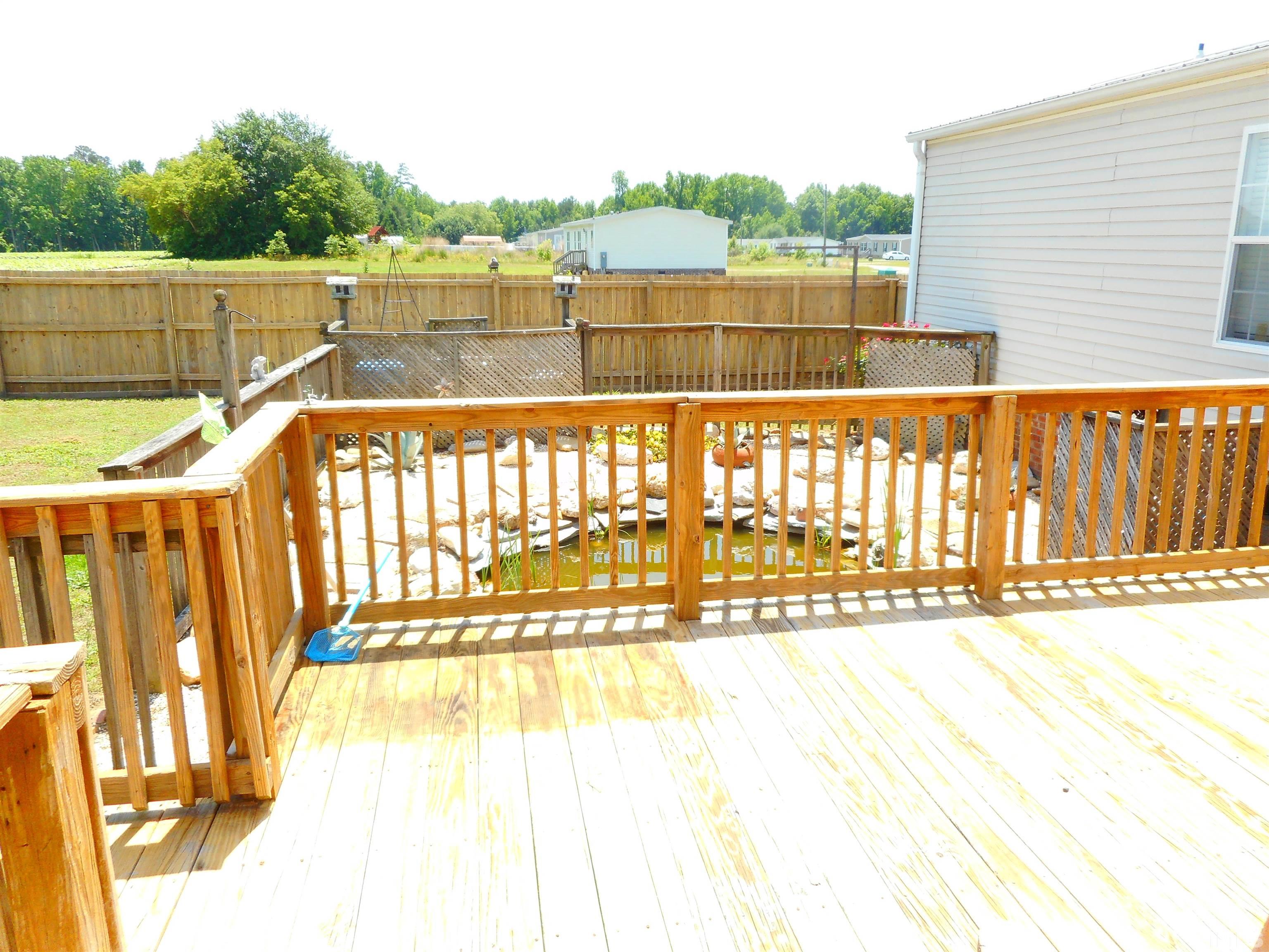 8605 Ransom Lane Kenly, NC 27542 - Photo 8 of 38 a view of a balcony with outdoor space