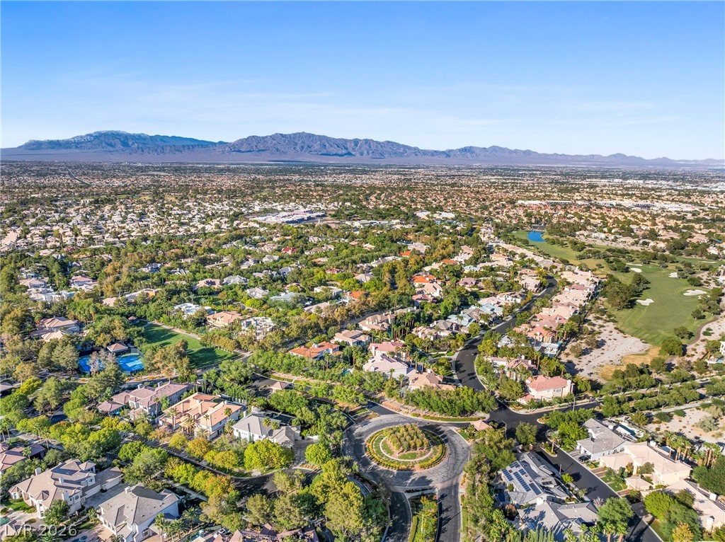 2000 Grouse Street Las Vegas, NV 89134 - Photo 73 of 89 Vast, verdant community with sprawling homes, winding roads, and distant mountain vistas.