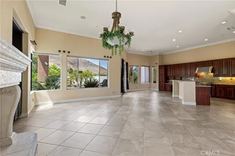 a view of a kitchen with furniture and a potted plant