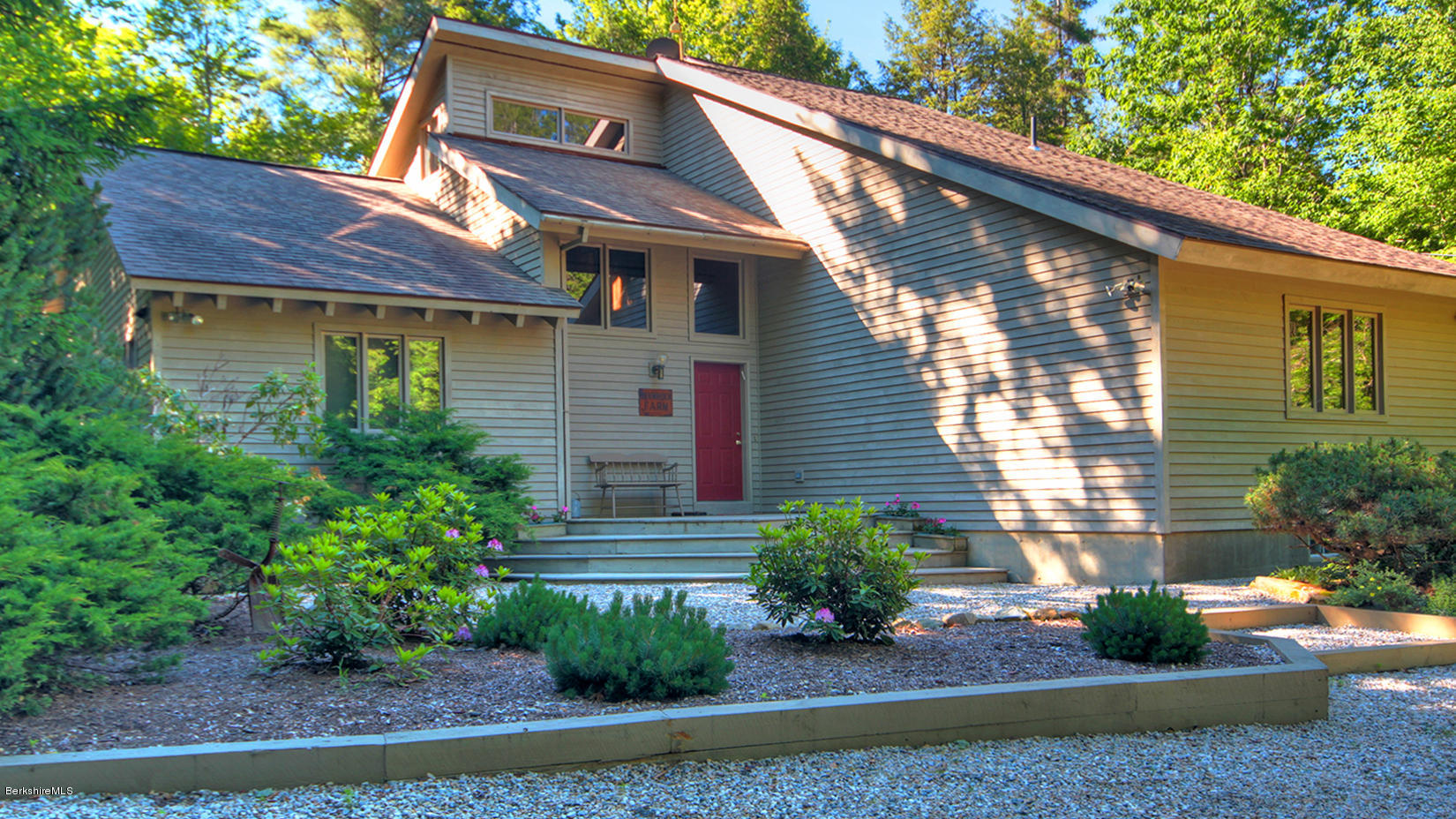 a front view of a house with garden