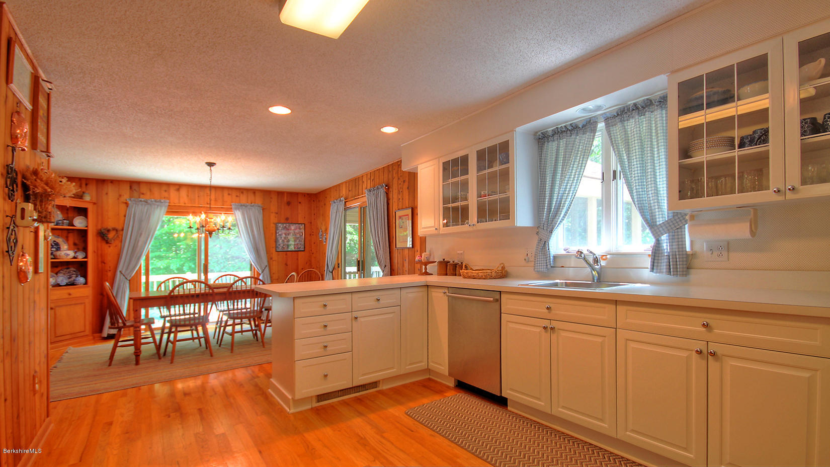 33 Sioux Road Becket, MA 01223 - Photo 11 of 33 a kitchen with stainless steel appliances granite countertop a stove a sink dishwasher and a microwave oven with cabinets