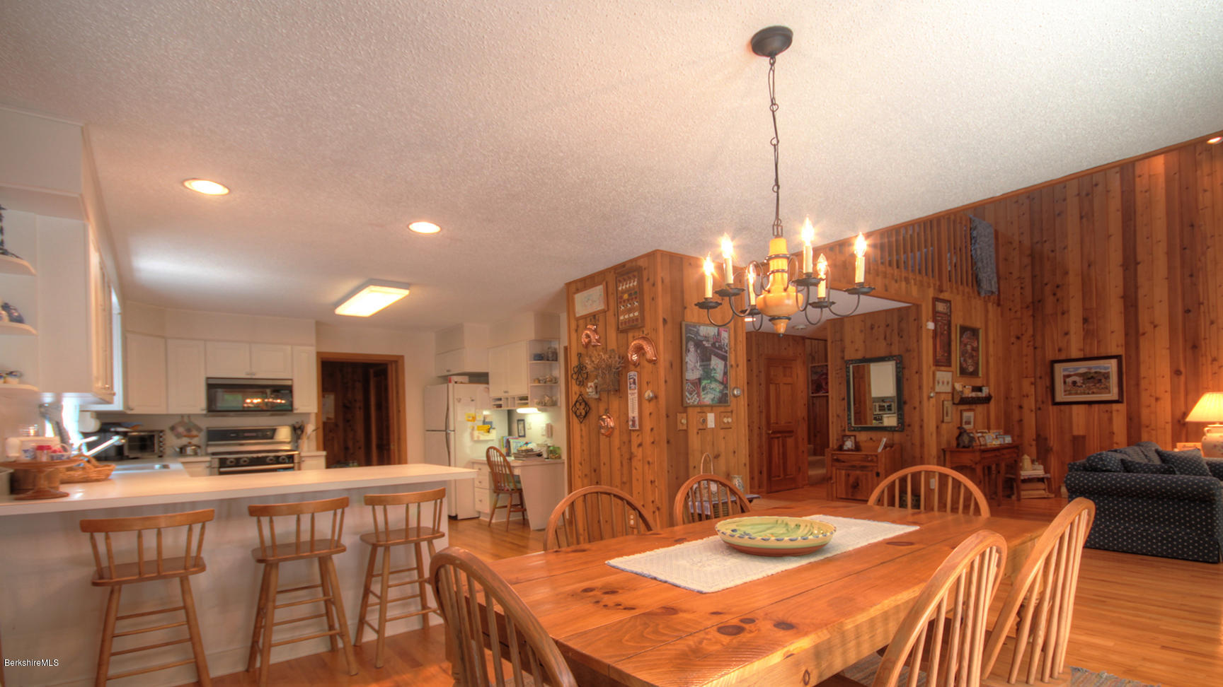 33 Sioux Road Becket, MA 01223 - Photo 13 of 33 a dining room filled chandelier and kitchen view
