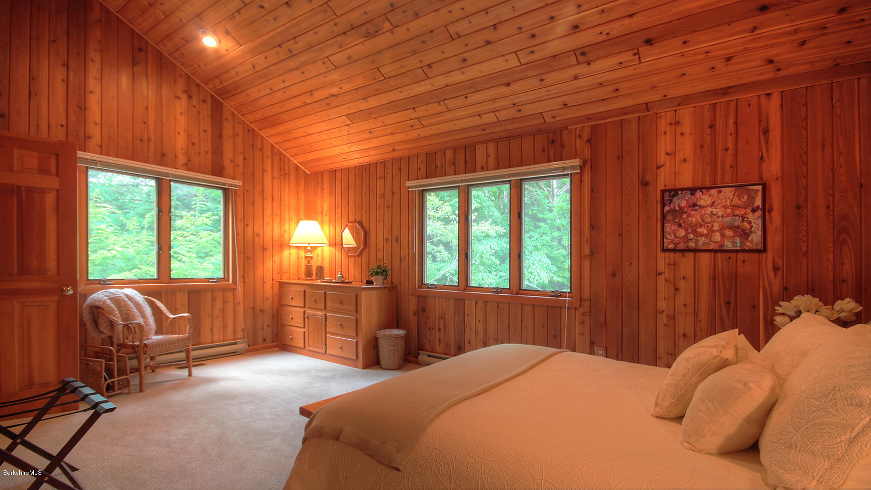 33 Sioux Road Becket, MA 01223 - Photo 24 of 33 a bedroom with a bed and glass windows