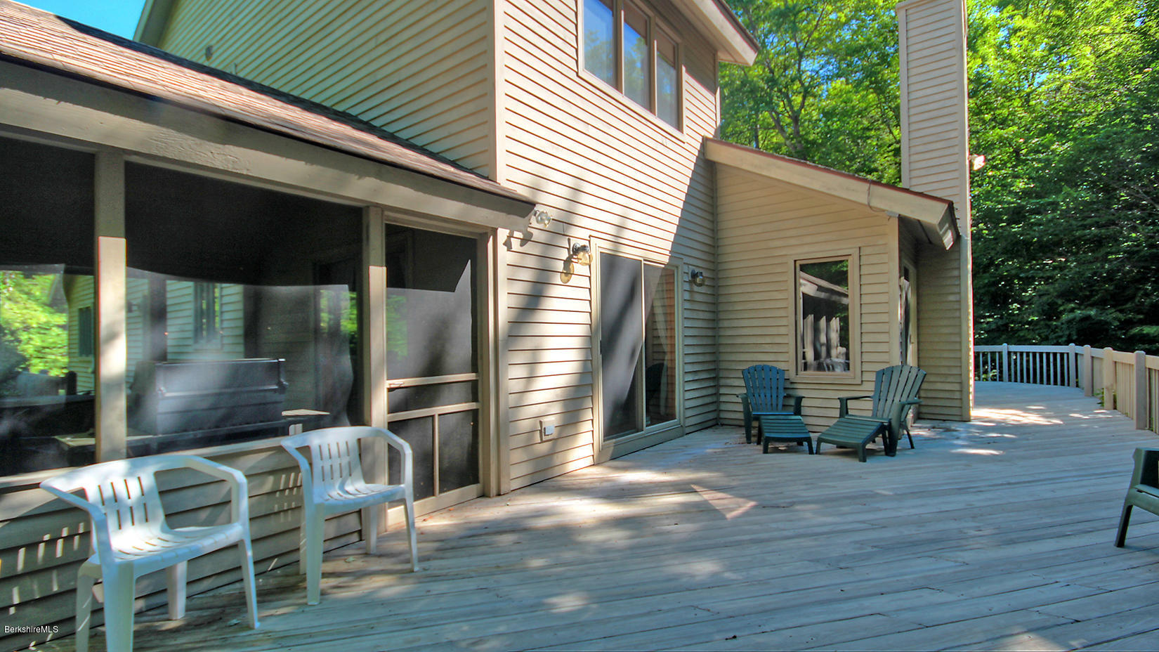 33 Sioux Road Becket, MA 01223 - Photo 28 of 33 a view of a patio with table and chairs and wooden floor