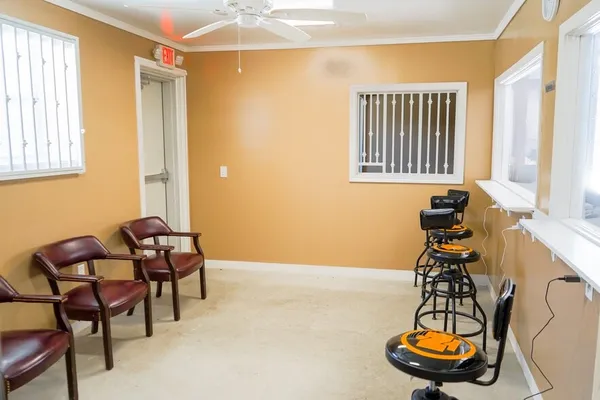 a room with a table and a window