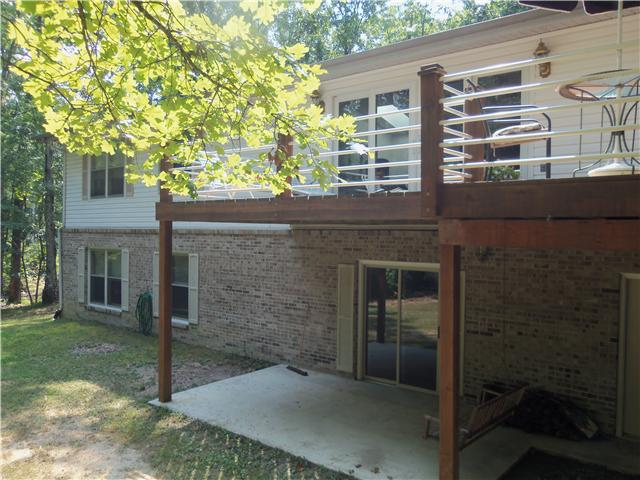 288 Deer Run Road Wartrace, TN 37183 - Photo 8 of 20 Back view of home w/walk-out basement, porch w/swing on patio area outside finished basement area. Lots of additional living space in this lower level of this amazing home.