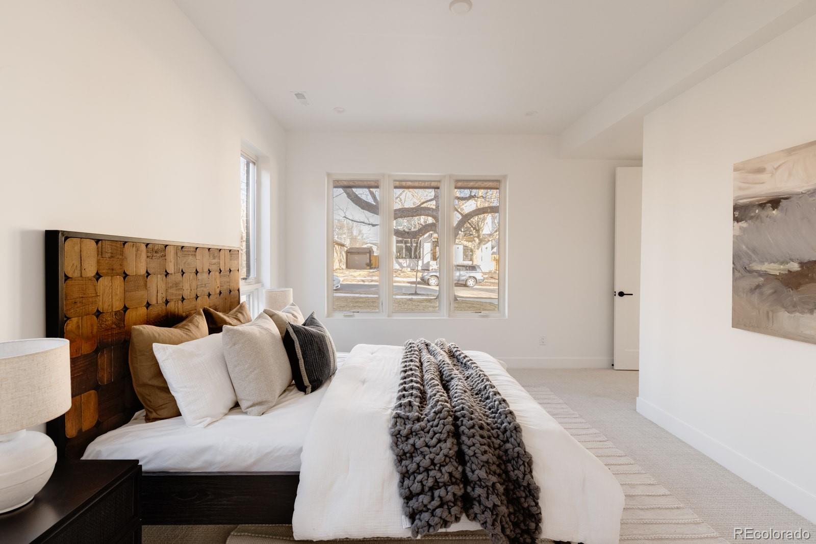 2112 Perry Street Denver, CO 80212 - Photo 13 of 49 a bedroom with a large bed and a window