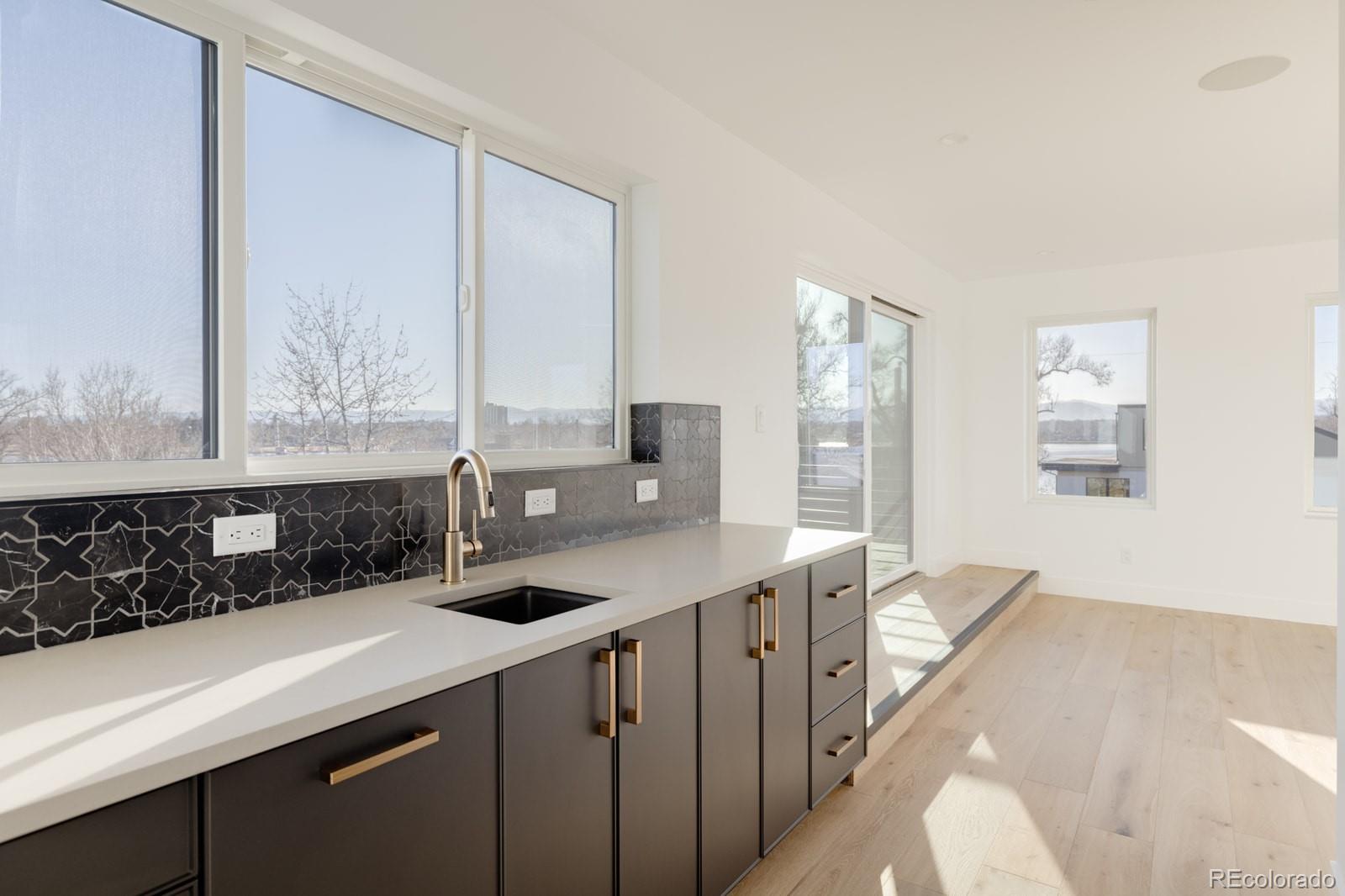 2112 Perry Street Denver, CO 80212 - Photo 26 of 49 a kitchen with a sink and a window