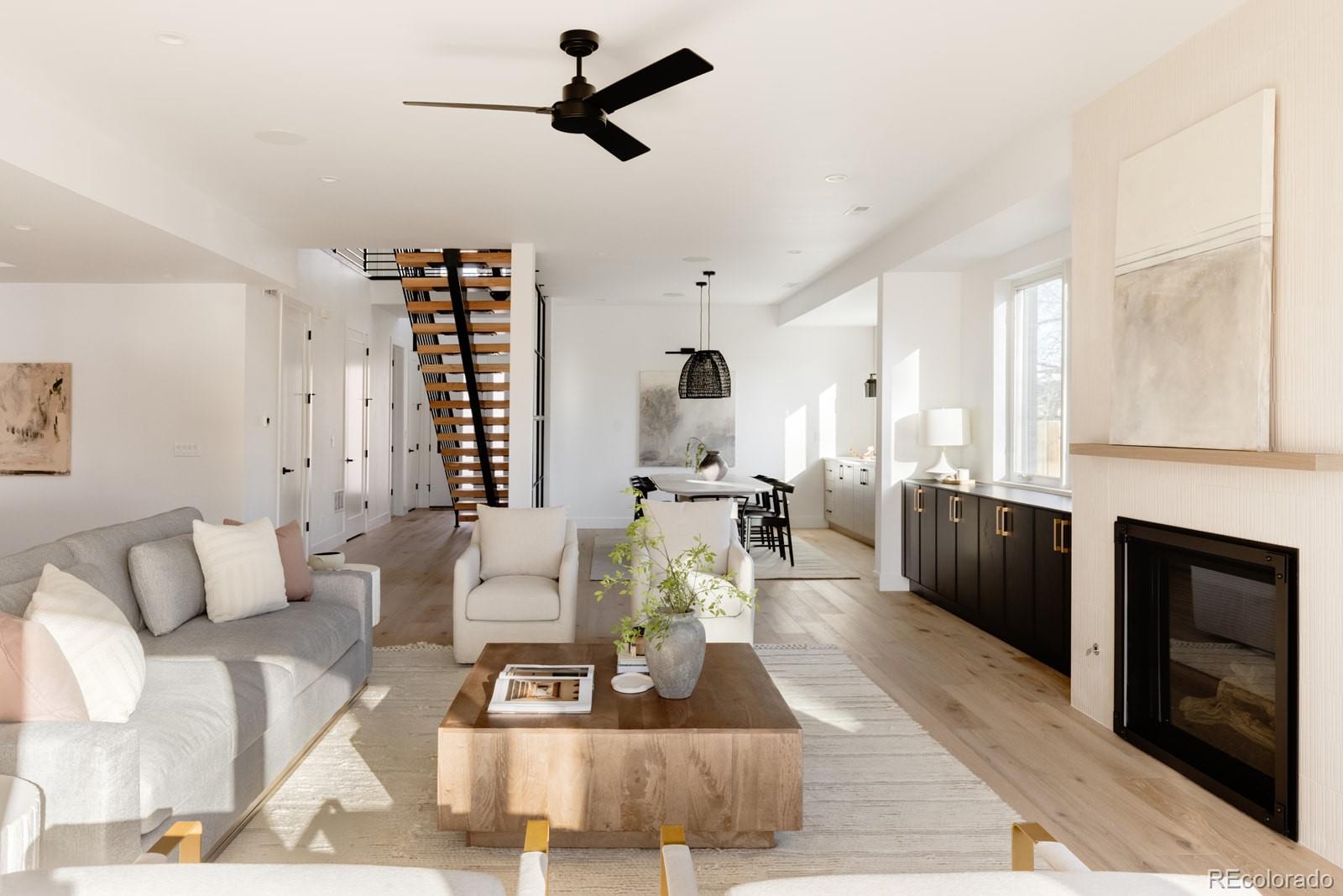 2112 Perry Street Denver, CO 80212 - Photo 5 of 49 a living room with furniture and a fireplace