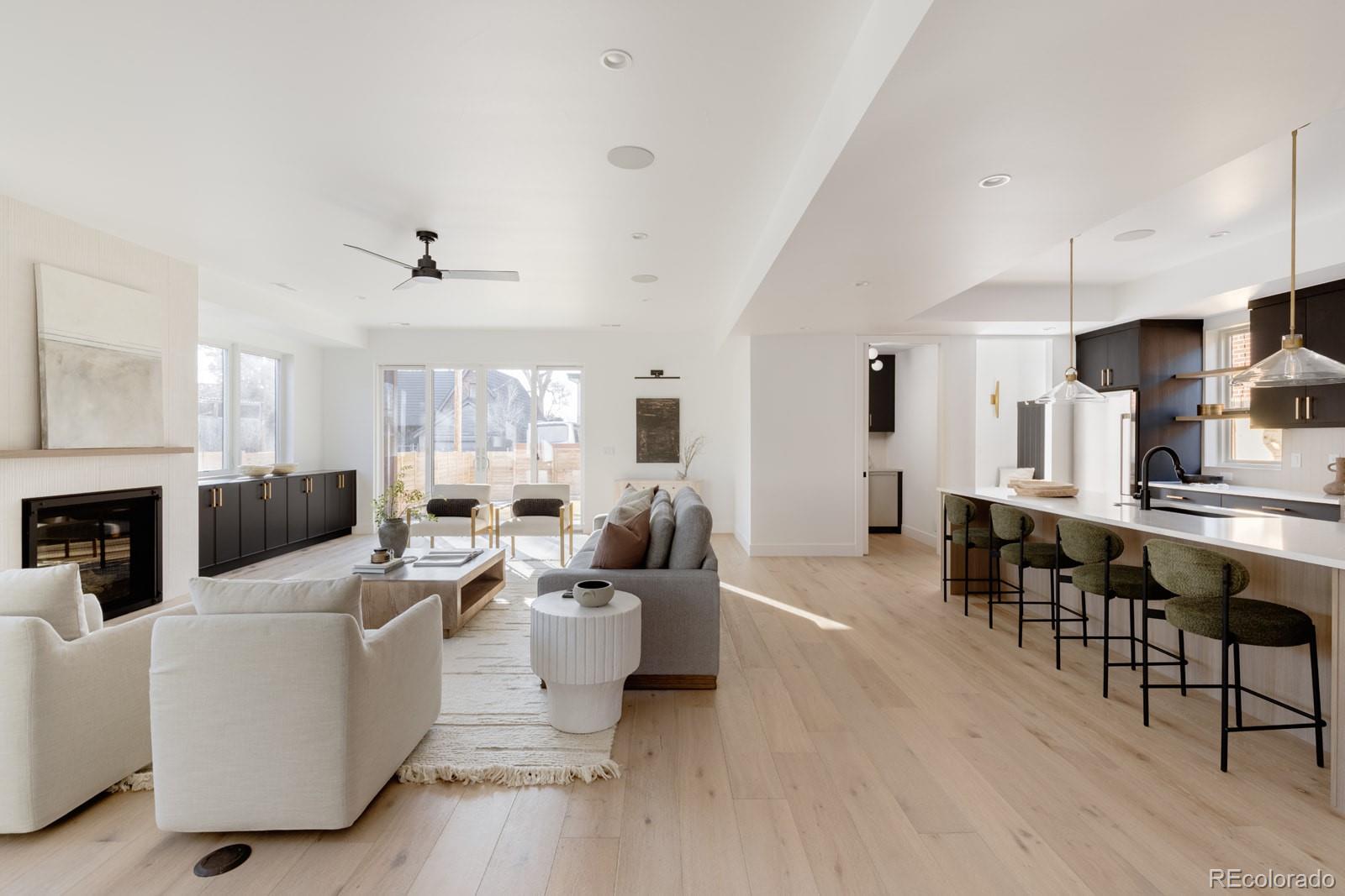 2112 Perry Street Denver, CO 80212 - Photo 9 of 49 a living room with fireplace furniture and a wooden floor