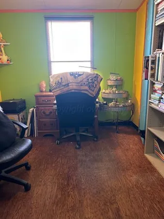 a bed room with a bed and a television