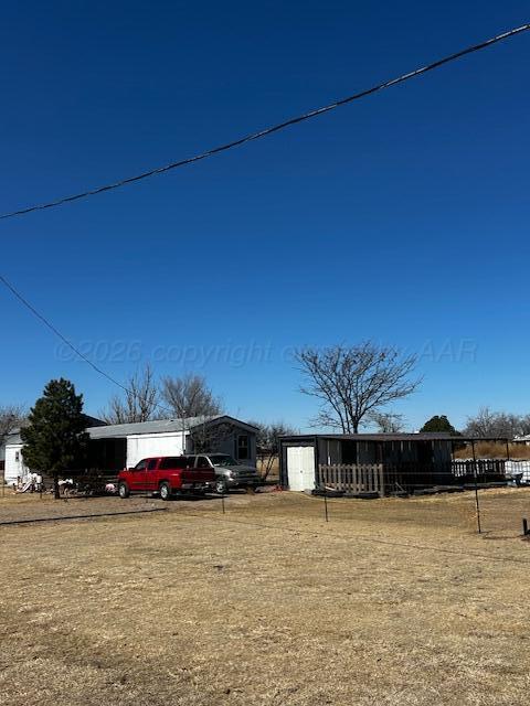 207 North Street Claude, TX 79019 - Photo 27 of 27 a front view of a house with a yard