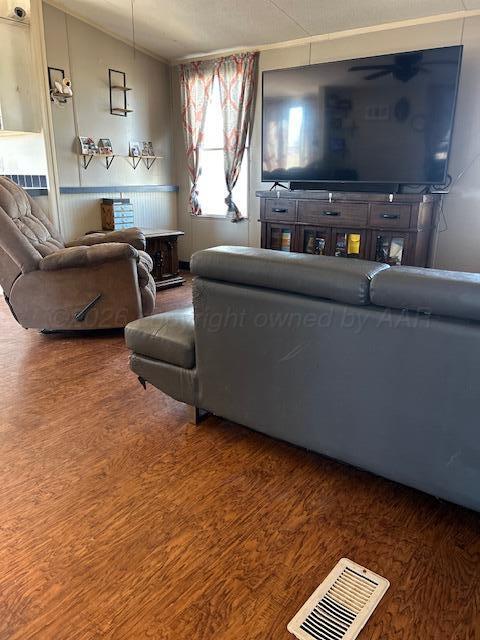 207 North Street Claude, TX 79019 - Photo 3 of 27 a living room with furniture and a flat screen tv