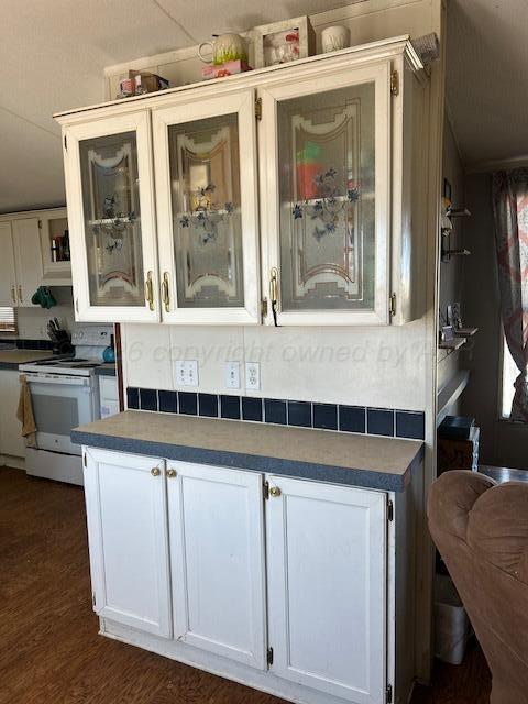 207 North Street Claude, TX 79019 - Photo 7 of 27 a kitchen with cabinets and outdoor view