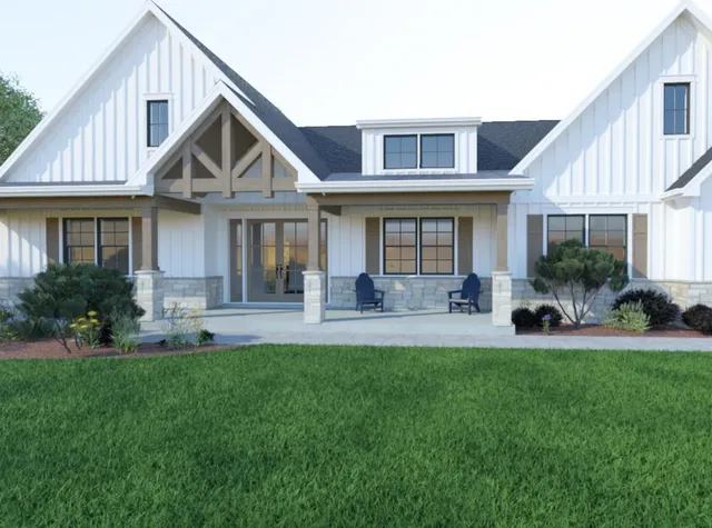 a front view of a house with a yard and porch
