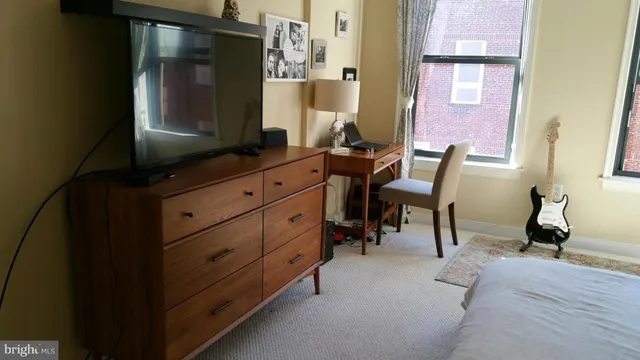 a room with mirror and furniture