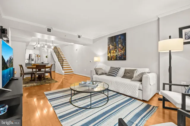 a living room with furniture and a table