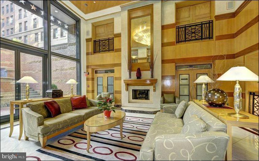 631 D Street Northwest, Unit 845 Washington, DC 20004 - Photo 16 of 30 a living room with furniture and a large window