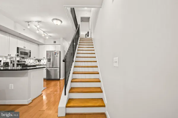 a bathroom with a sink vanity and a mirror