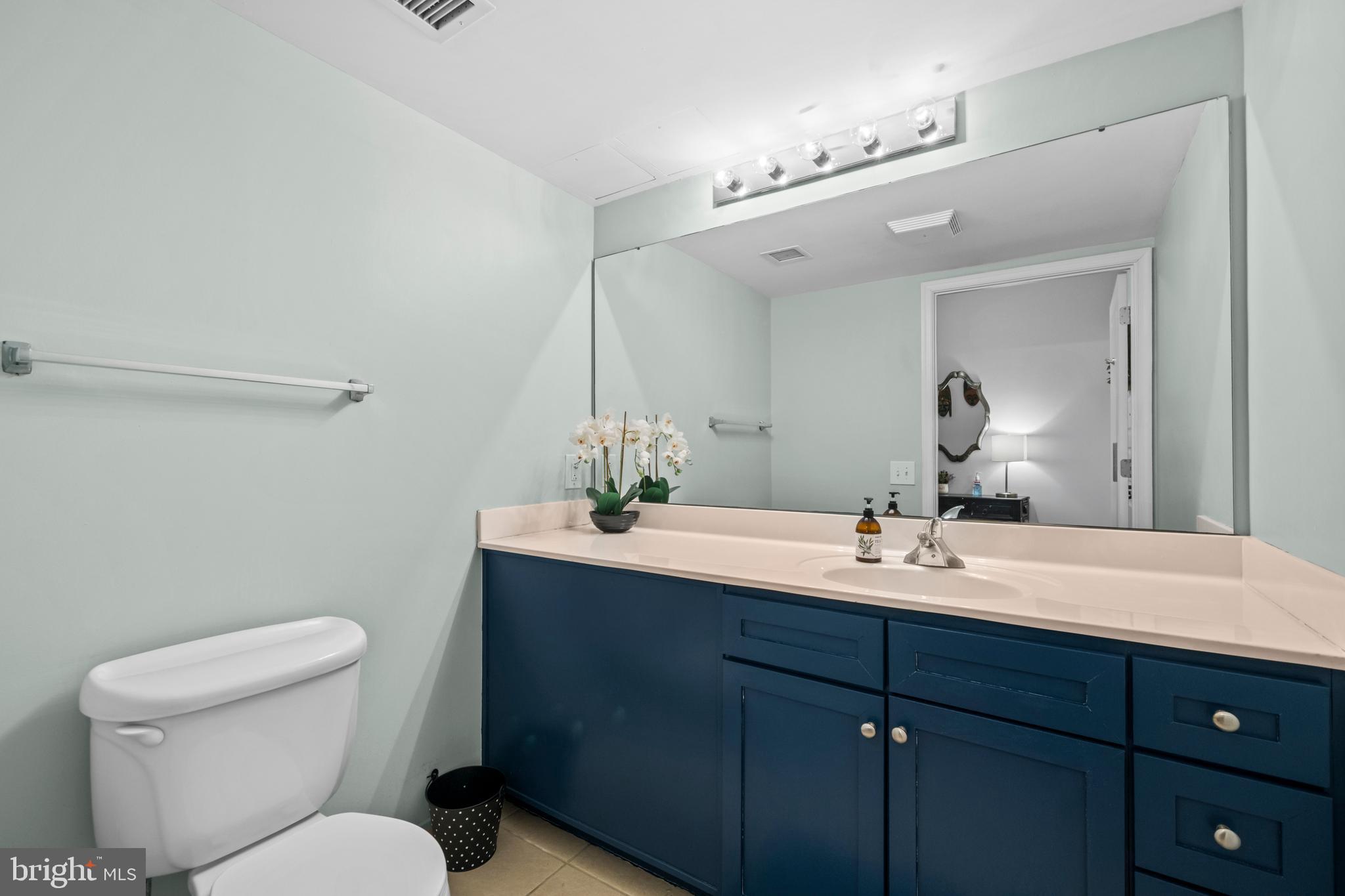 631 D Street Northwest, Unit 845 Washington, DC 20004 - Photo 17 of 84 a bathroom with a toilet sink and mirror