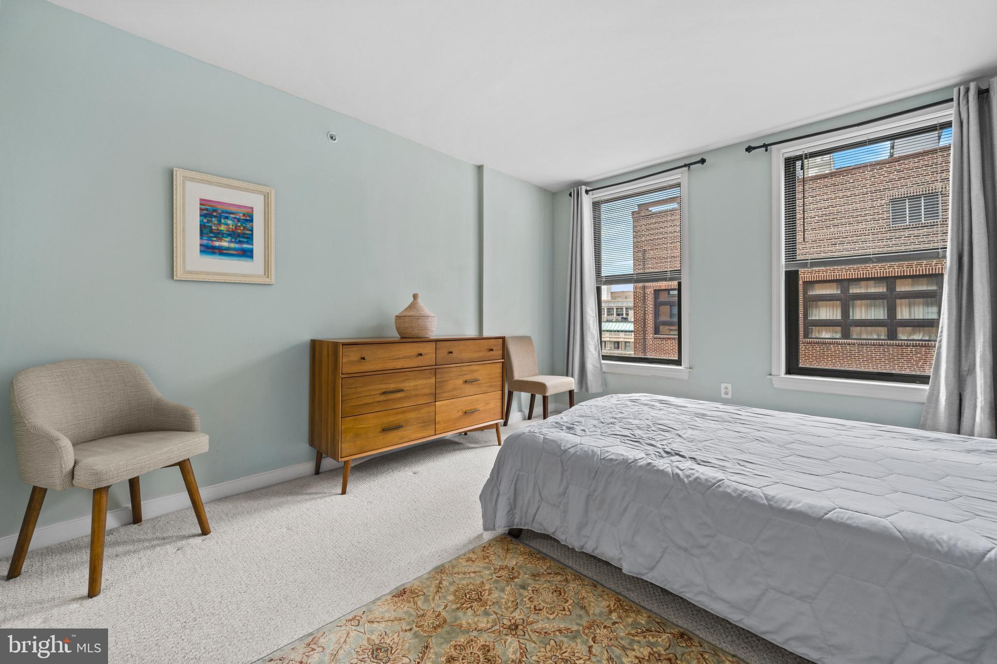 631 D Street Northwest, Unit 845 Washington, DC 20004 - Photo 30 of 84 a bedroom with a bed and window