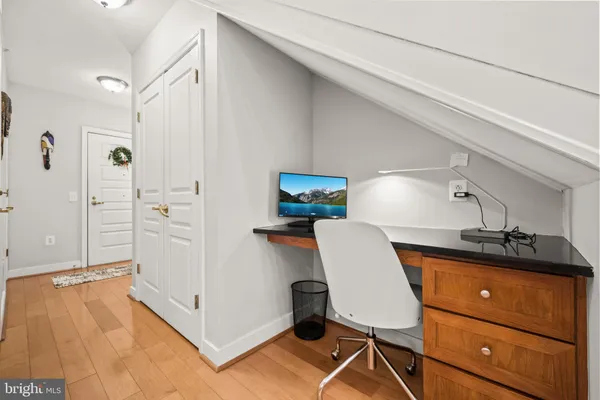 a kitchen with stainless steel appliances granite countertop a sink a stove and cabinets